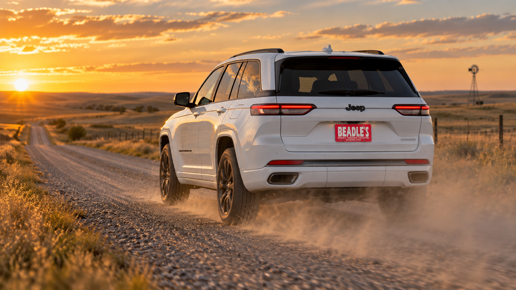 2026 Jeep Grand Cherokee on a gravel road at sunset in South Dakota, at Beadle's Chrysler Center
