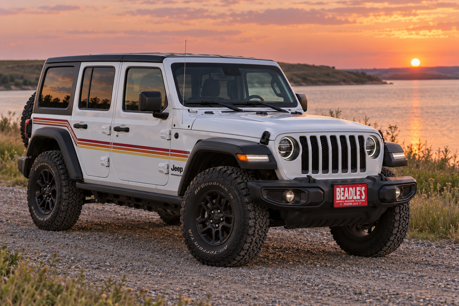 Two-tone 2027 Jeep Wrangler special edition 4-Door parked at the Lake Oahe shoreline in South Dakota, at Beadle's Chrysler Center